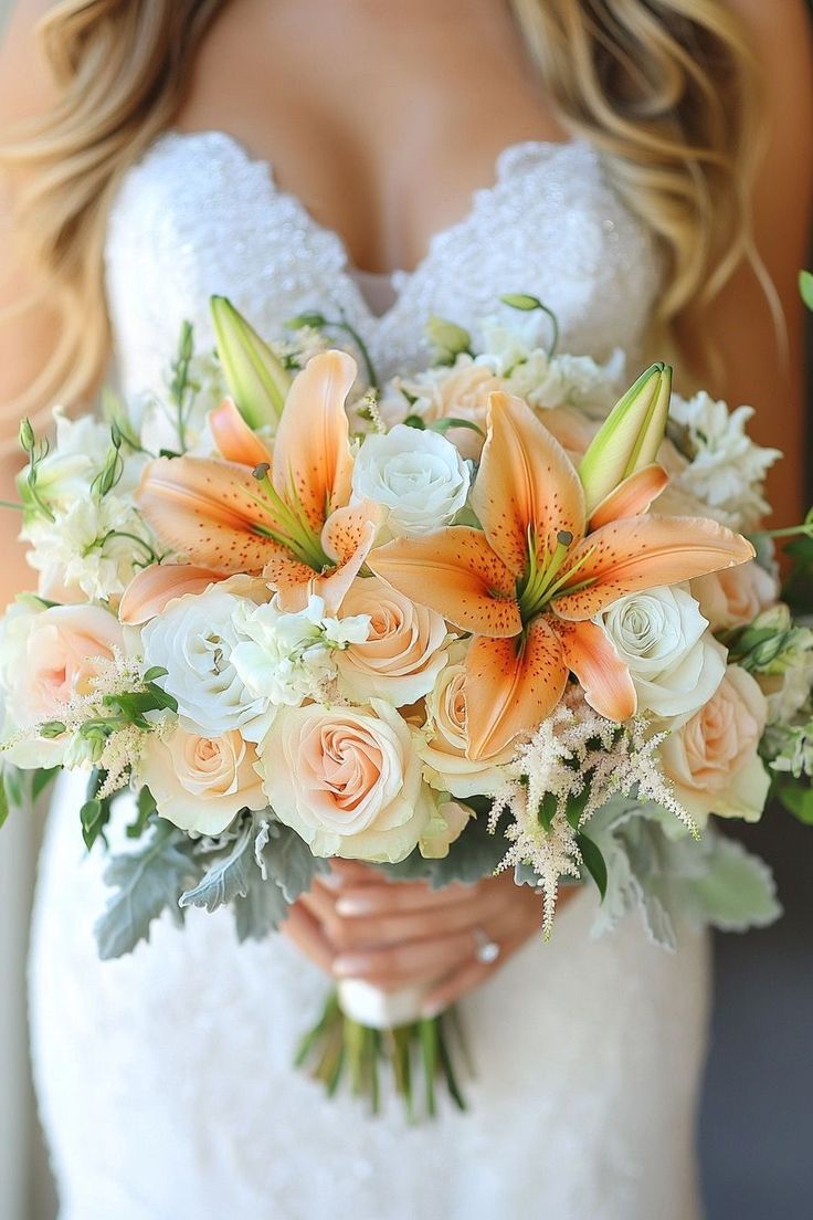 Bride holding elegant orange roses